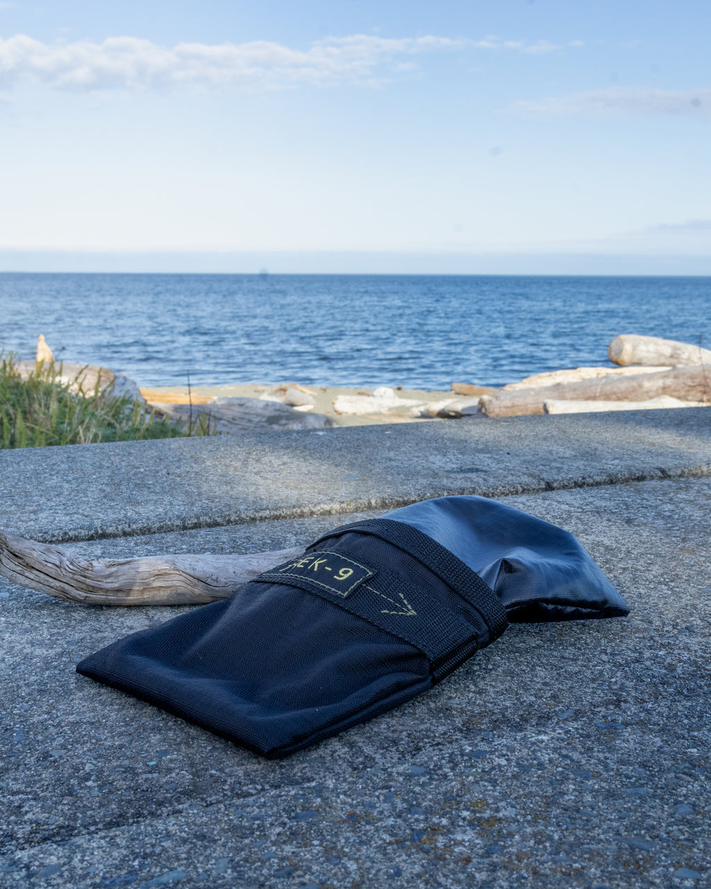 Black Trek-9 dog treat pouch with reversible liner and magnetic closure. Made from high durability ripstop fabric for both the shell and the liner. Easy to wash, and dries quick. Has a belt loop for attaching to body or bag. 