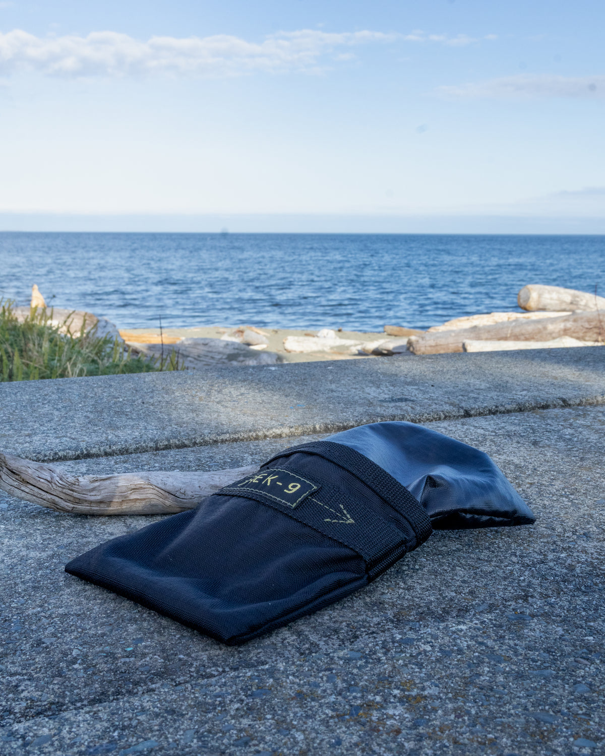 Black Trek-9 dog treat pouch with reversible liner and magnetic closure. Made from high durability ripstop fabric for both the shell and the liner. Easy to wash, and dries quick. Has a belt loop for attaching to body or bag. 