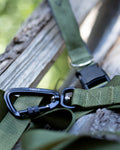 Green Adjustable and hands-free dog leash, featuring a swivel carabiner, high strength side release buckle, nickel plated d-ring, and high strength nylon webbing. 